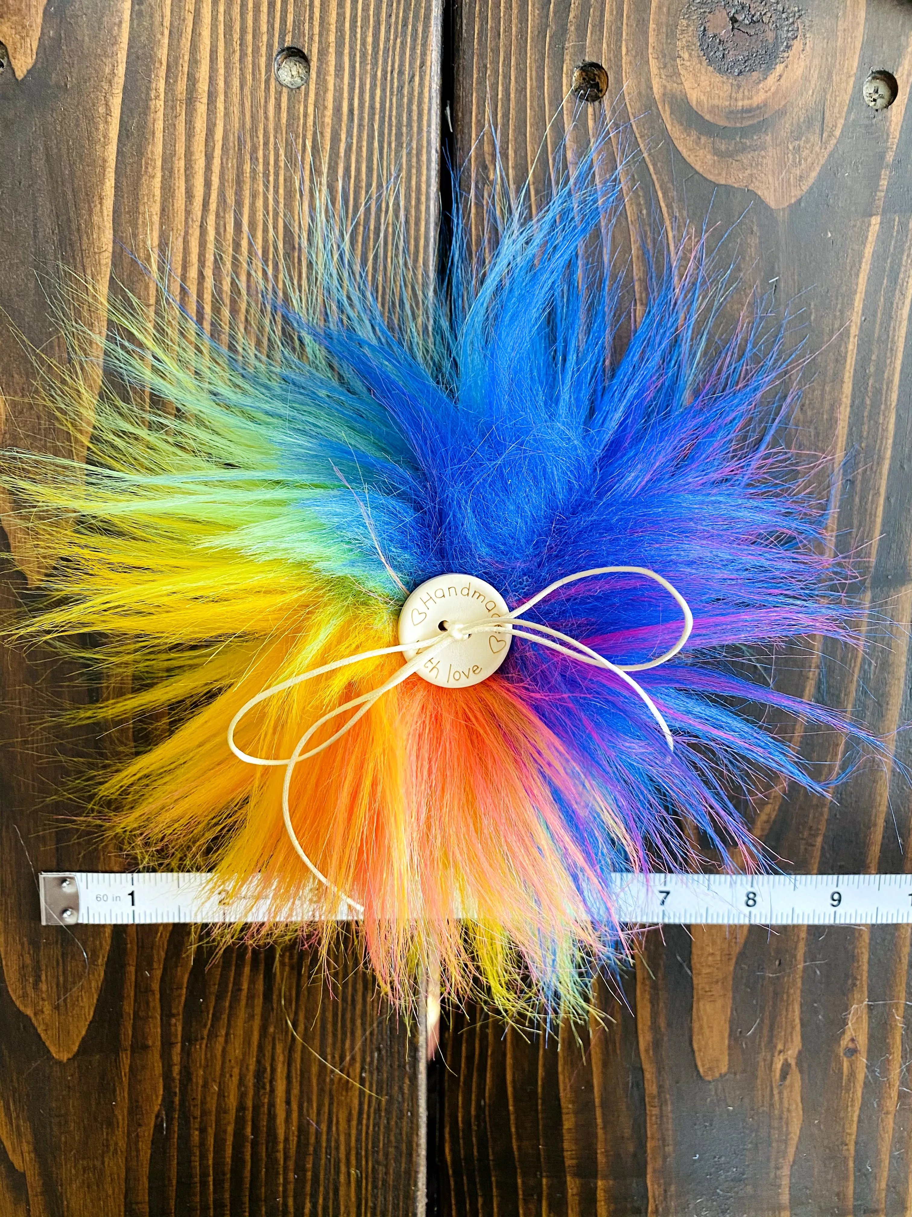 MADE TO ORDER Fun and funky rainbow blue purple hot pink yellow orange green faux fur pom pom with wooden button